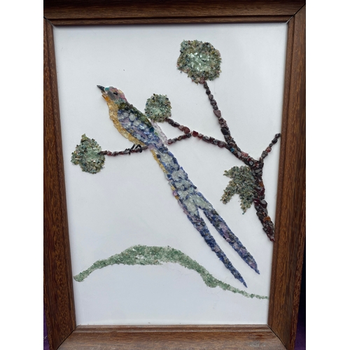 725 - Two framed gemstone art works.