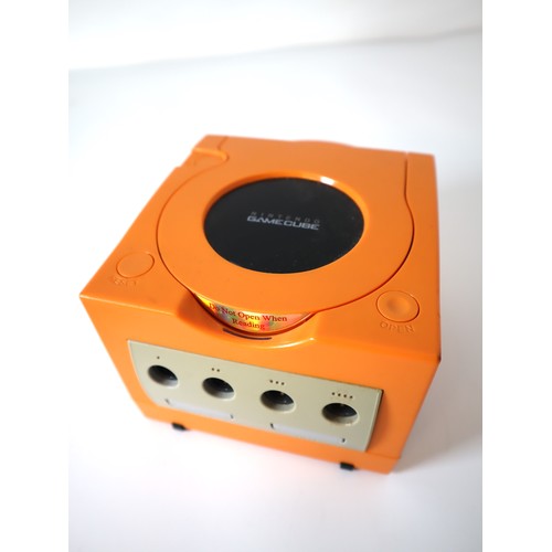 63 - Nintendo Cube Orange Uprated Iced Cube case + poer cable and Two games Madden 2005 & FIFA Football 2... 