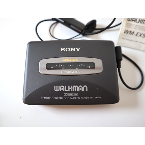 69 - Sony Walkman Cassette Player WM-EX508 with stick controller headphones + instructions