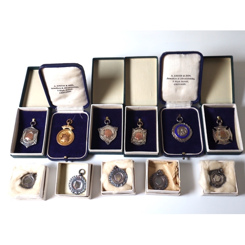 91 - Collection of early 20th century Silver + 9ct yellow gold Hockey Sports Medals in original cases