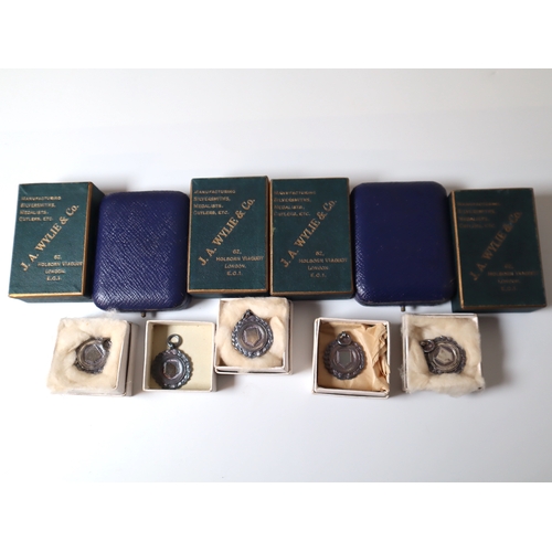 91 - Collection of early 20th century Silver + 9ct yellow gold Hockey Sports Medals in original cases