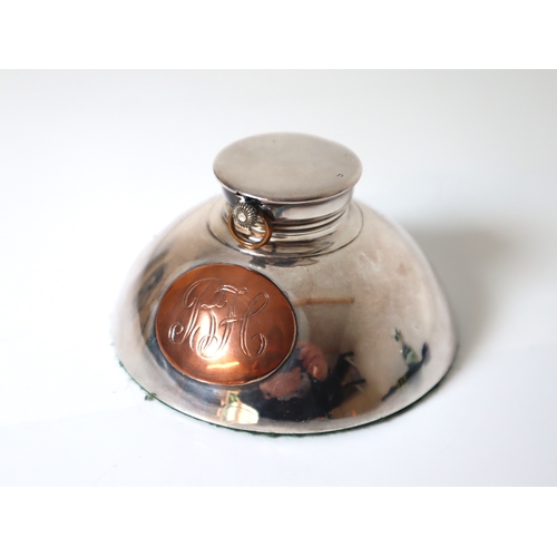 98 - Sterling Silver Inkwell revealing a white enamelled pocket clock with copper oval monogram