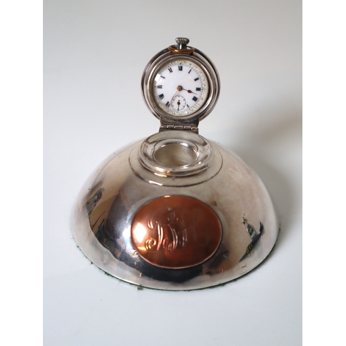 98 - Sterling Silver Inkwell revealing a white enamelled pocket clock with copper oval monogram