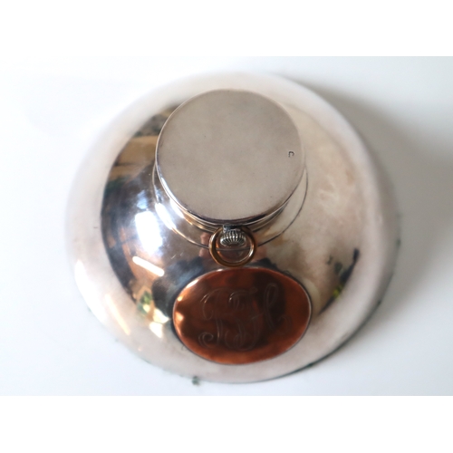 98 - Sterling Silver Inkwell revealing a white enamelled pocket clock with copper oval monogram