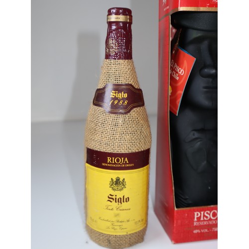 79A - Siglo 1988 Rioja, Pisco Reservado 40% vol 750ml in Easter Island Head decanter + Ferrerira Porto Bra... 