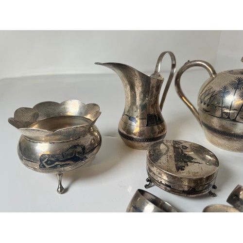 118A - Egyptian Silver Tea Service including Tea Pot , Pourer, Sugar Pot, Tongs, Napkin Rings, + Two lidded... 