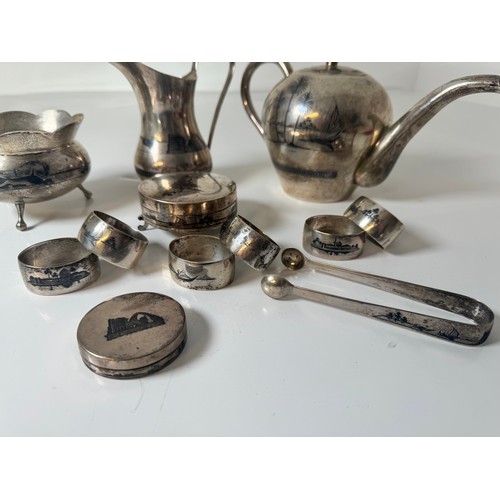 118A - Egyptian Silver Tea Service including Tea Pot , Pourer, Sugar Pot, Tongs, Napkin Rings, + Two lidded... 