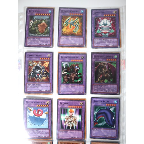 154 - A group of 8 pages of Yu-Gi-Oh Trading Cards including singles from collectors tins , starter decks ... 