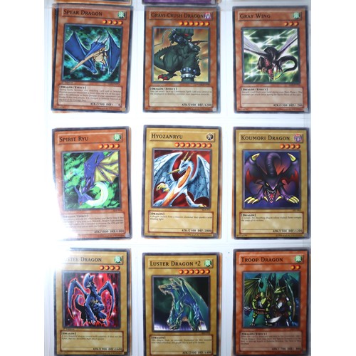 154 - A group of 8 pages of Yu-Gi-Oh Trading Cards including singles from collectors tins , starter decks ... 