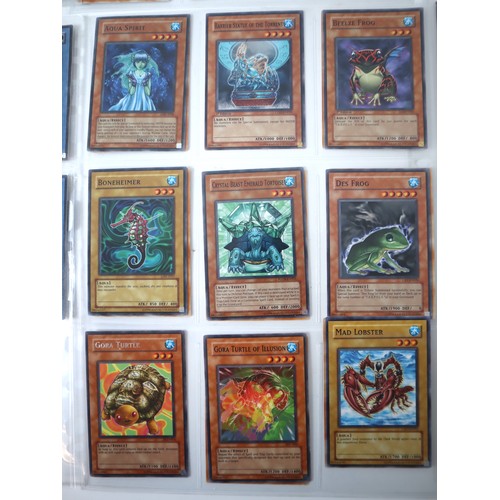 154 - A group of 8 pages of Yu-Gi-Oh Trading Cards including singles from collectors tins , starter decks ... 