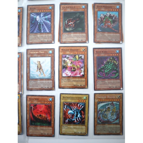 154 - A group of 8 pages of Yu-Gi-Oh Trading Cards including singles from collectors tins , starter decks ... 