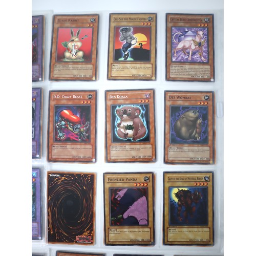 154 - A group of 8 pages of Yu-Gi-Oh Trading Cards including singles from collectors tins , starter decks ... 