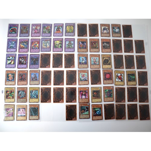 154 - A group of 8 pages of Yu-Gi-Oh Trading Cards including singles from collectors tins , starter decks ... 