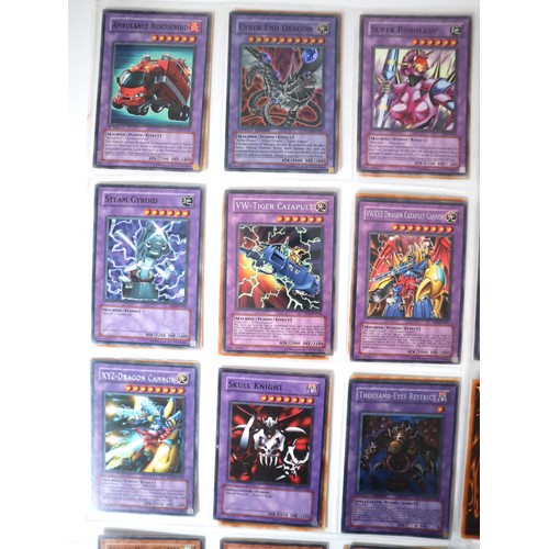 154 - A group of 8 pages of Yu-Gi-Oh Trading Cards including singles from collectors tins , starter decks ... 