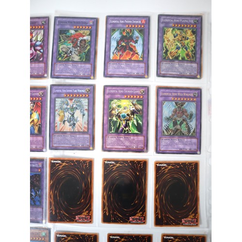 154 - A group of 8 pages of Yu-Gi-Oh Trading Cards including singles from collectors tins , starter decks ... 