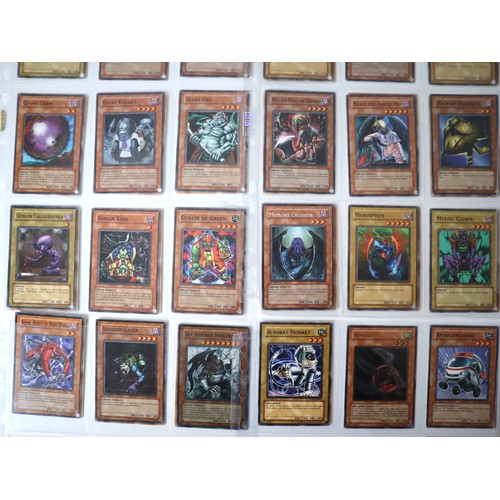 155 - A group of approximately 200 Yu-Gi-Oh Trading Cards including singles from collectors tins , starter... 