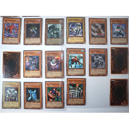 155 - A group of approximately 200 Yu-Gi-Oh Trading Cards including singles from collectors tins , starter... 