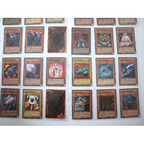 155 - A group of approximately 200 Yu-Gi-Oh Trading Cards including singles from collectors tins , starter... 