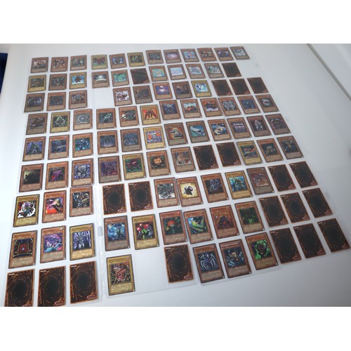 155 - A group of approximately 200 Yu-Gi-Oh Trading Cards including singles from collectors tins , starter... 