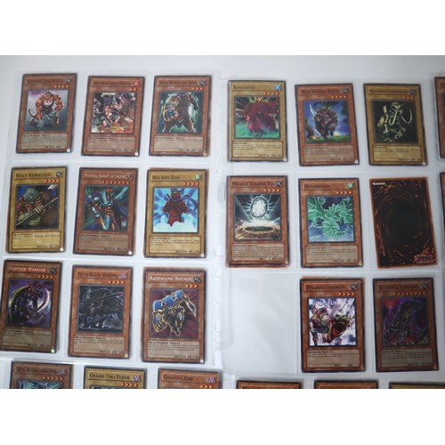 155 - A group of approximately 200 Yu-Gi-Oh Trading Cards including singles from collectors tins , starter... 