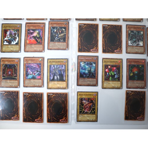 155 - A group of approximately 200 Yu-Gi-Oh Trading Cards including singles from collectors tins , starter... 