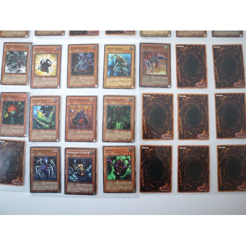 155 - A group of approximately 200 Yu-Gi-Oh Trading Cards including singles from collectors tins , starter... 