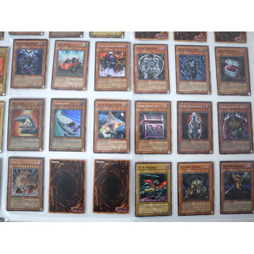 155 - A group of approximately 200 Yu-Gi-Oh Trading Cards including singles from collectors tins , starter... 