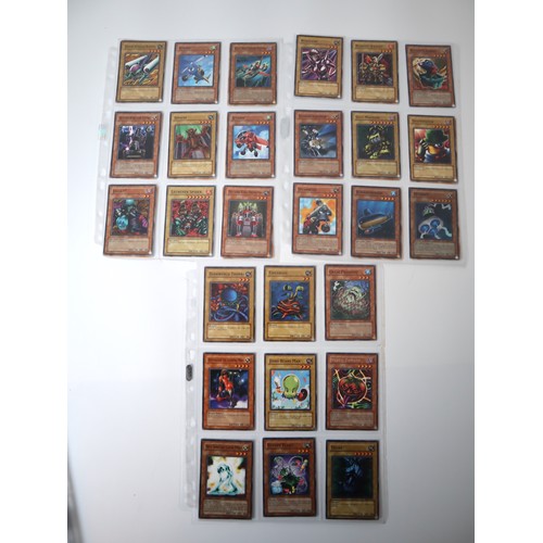 155 - A group of approximately 200 Yu-Gi-Oh Trading Cards including singles from collectors tins , starter... 