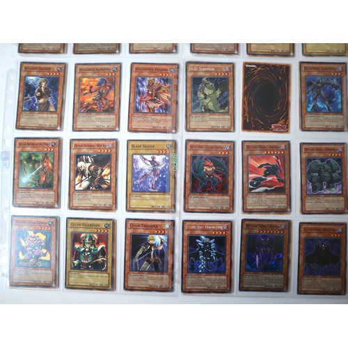 156 - A group of approximately 200 Yu-Gi-Oh Trading Cards including singles from collectors tins , starter... 