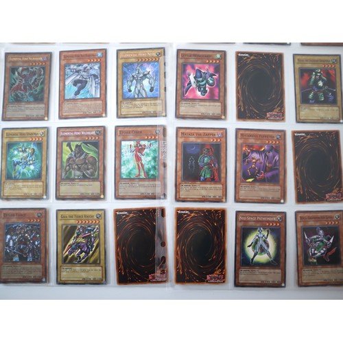 156 - A group of approximately 200 Yu-Gi-Oh Trading Cards including singles from collectors tins , starter... 