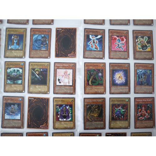 156 - A group of approximately 200 Yu-Gi-Oh Trading Cards including singles from collectors tins , starter... 