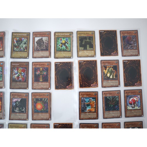 156 - A group of approximately 200 Yu-Gi-Oh Trading Cards including singles from collectors tins , starter... 