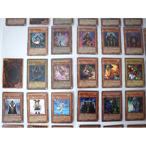 156 - A group of approximately 200 Yu-Gi-Oh Trading Cards including singles from collectors tins , starter... 