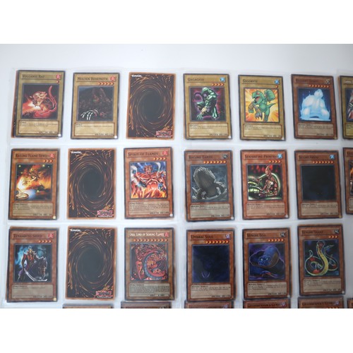 156 - A group of approximately 200 Yu-Gi-Oh Trading Cards including singles from collectors tins , starter... 