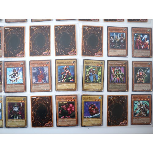 156 - A group of approximately 200 Yu-Gi-Oh Trading Cards including singles from collectors tins , starter... 