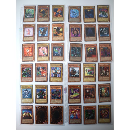 156 - A group of approximately 200 Yu-Gi-Oh Trading Cards including singles from collectors tins , starter... 