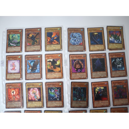 156 - A group of approximately 200 Yu-Gi-Oh Trading Cards including singles from collectors tins , starter... 