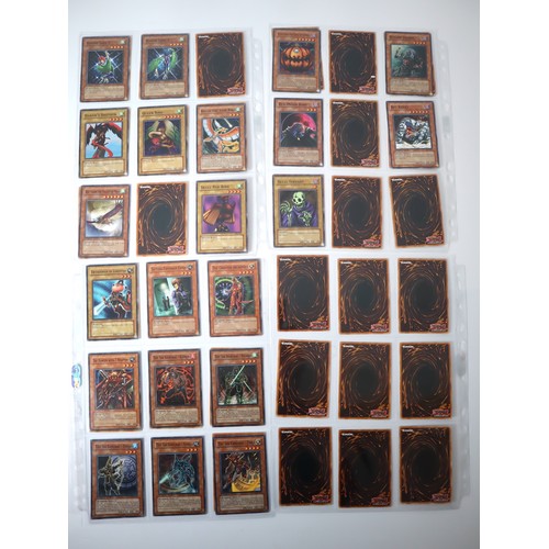 156 - A group of approximately 200 Yu-Gi-Oh Trading Cards including singles from collectors tins , starter... 