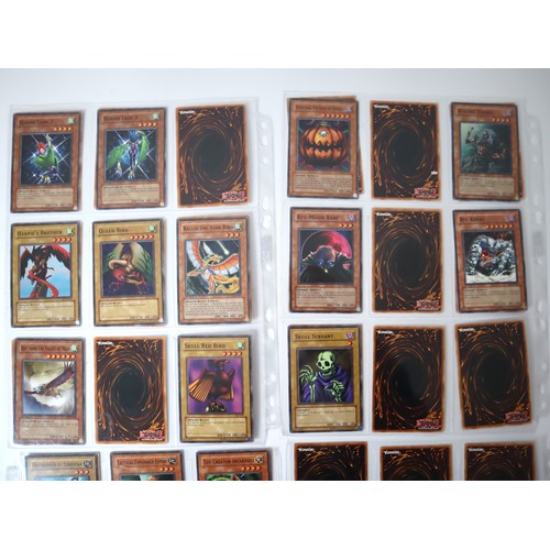 156 - A group of approximately 200 Yu-Gi-Oh Trading Cards including singles from collectors tins , starter... 