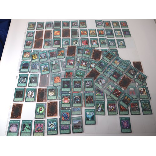 159 - A group of approximately 200 Yu-Gi-Oh Spell Trading Cards including singles from collectors tins , s... 