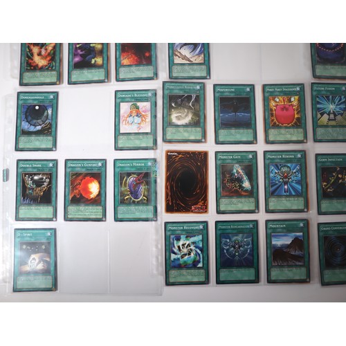 159 - A group of approximately 200 Yu-Gi-Oh Spell Trading Cards including singles from collectors tins , s... 