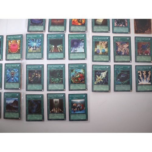 159 - A group of approximately 200 Yu-Gi-Oh Spell Trading Cards including singles from collectors tins , s... 