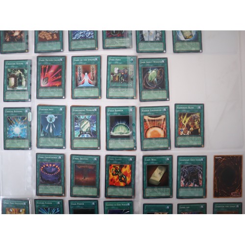 159 - A group of approximately 200 Yu-Gi-Oh Spell Trading Cards including singles from collectors tins , s... 