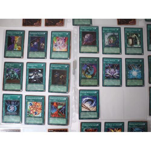 159 - A group of approximately 200 Yu-Gi-Oh Spell Trading Cards including singles from collectors tins , s... 