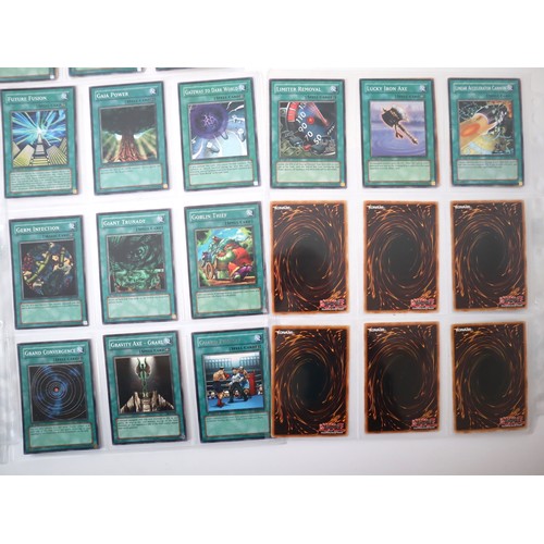 159 - A group of approximately 200 Yu-Gi-Oh Spell Trading Cards including singles from collectors tins , s... 