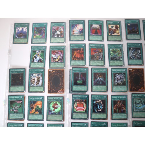 159 - A group of approximately 200 Yu-Gi-Oh Spell Trading Cards including singles from collectors tins , s... 