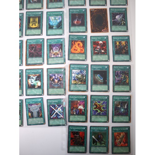 159 - A group of approximately 200 Yu-Gi-Oh Spell Trading Cards including singles from collectors tins , s... 