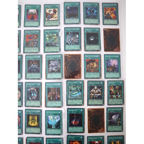 159 - A group of approximately 200 Yu-Gi-Oh Spell Trading Cards including singles from collectors tins , s... 