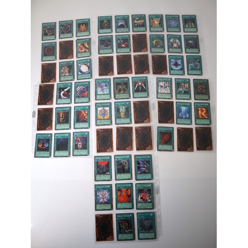 159 - A group of approximately 200 Yu-Gi-Oh Spell Trading Cards including singles from collectors tins , s... 