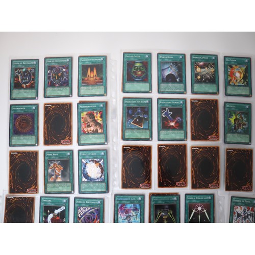 159 - A group of approximately 200 Yu-Gi-Oh Spell Trading Cards including singles from collectors tins , s... 